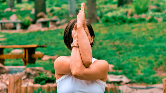 Image of a woman in a yoga pose, symbolizing balance and harmony after taking Fulvic Acid for her Leaky Gut.