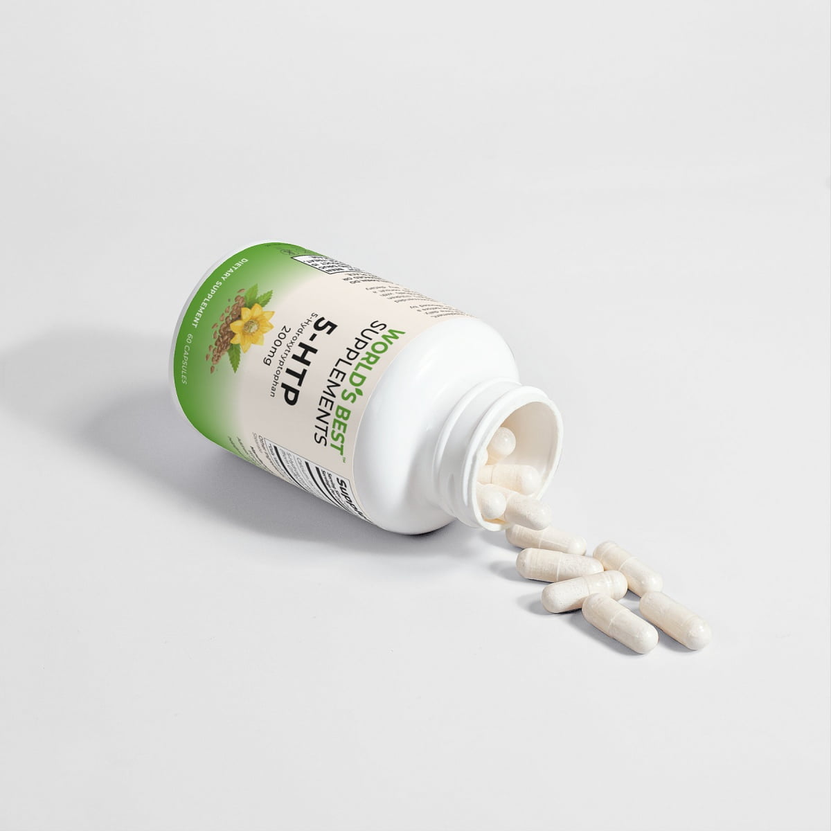 A bottle of 5-HTP (5-Hydroxytryptophan) from World's Best Supplements tipped over on a table with some of the capsules coming out of it.
