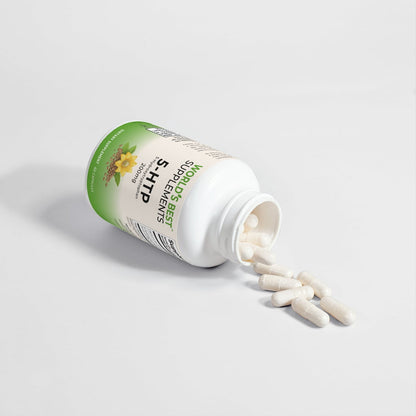 A bottle of 5-HTP (5-Hydroxytryptophan) from World's Best Supplements tipped over on a table with some of the capsules coming out of it.