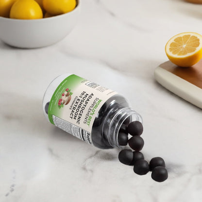 Some Adaptogenic Mushroom Extract Gummies from World's Best Supplements pouring out of the bottle onto the kitchen counter.