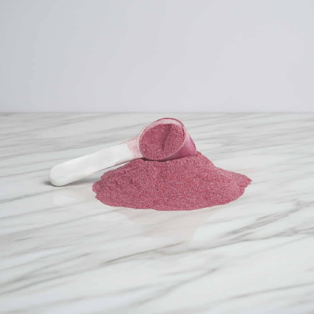 A scooper and pile of Beetroot Powder from World's Best Supplements.