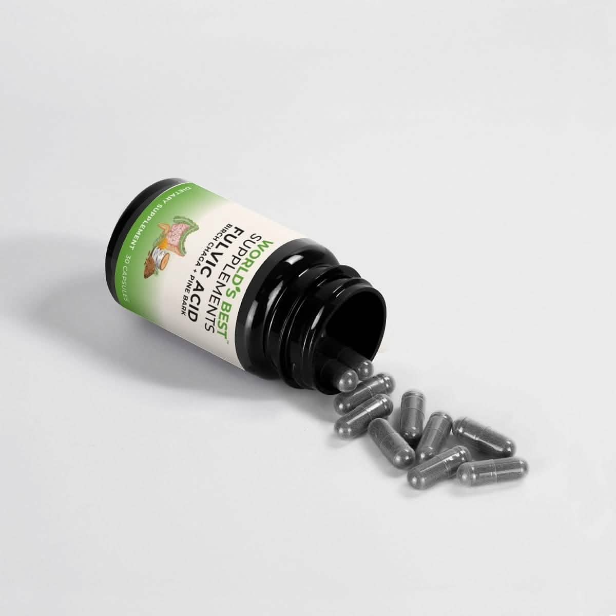A black bottle of Fulvic Acid Capsules from World's Best Supplements with the capsules pouring onto a table.