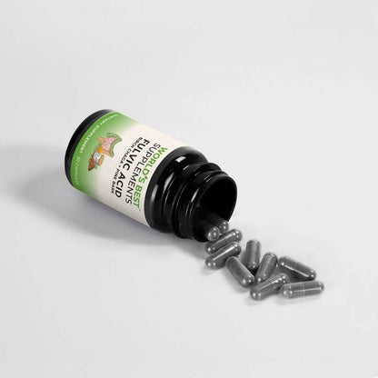 A black bottle of Fulvic Acid Capsules from World's Best Supplements with the capsules pouring onto a table.